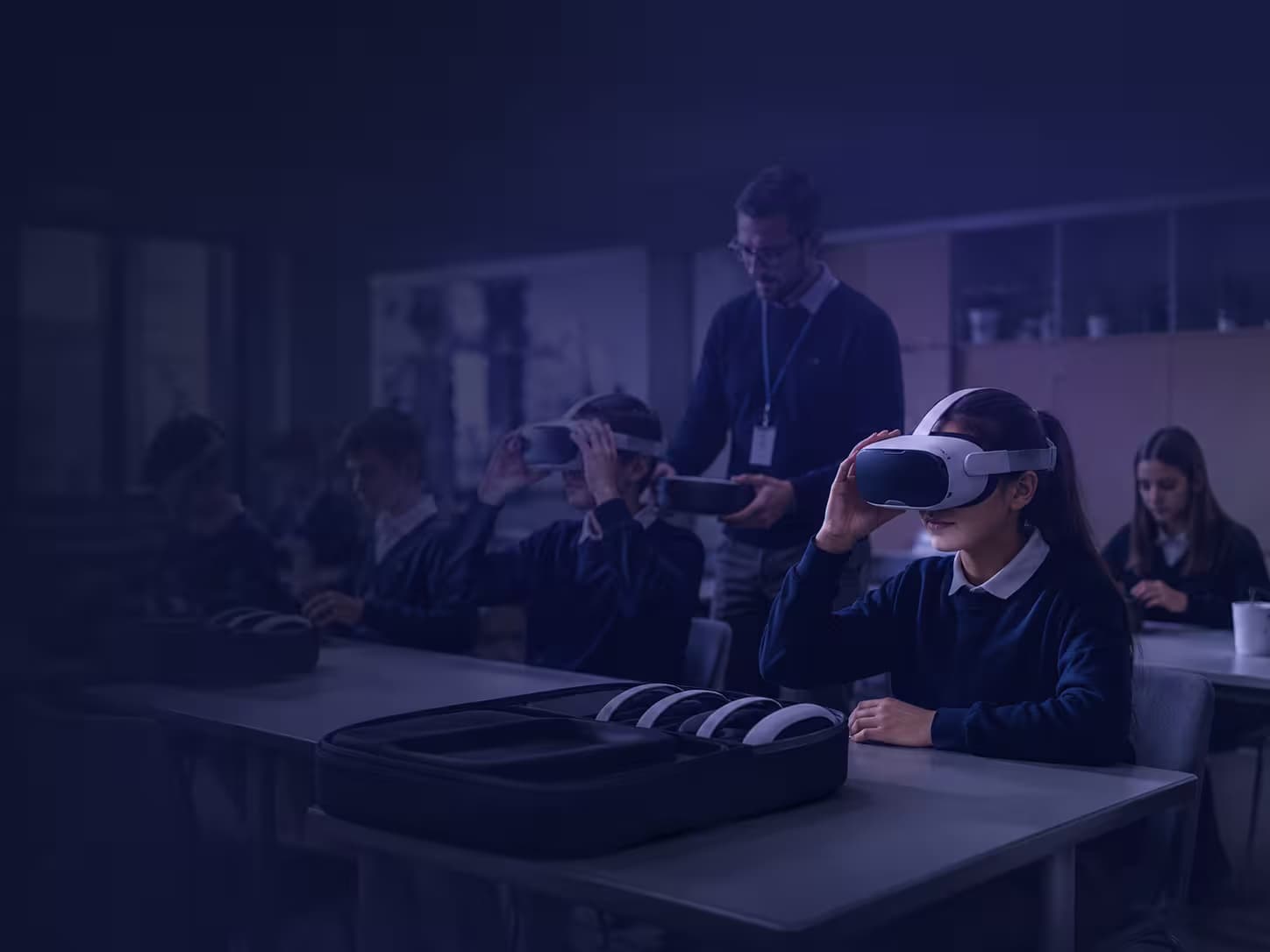 Students using VR headsets during a classroom deployment with teacher support